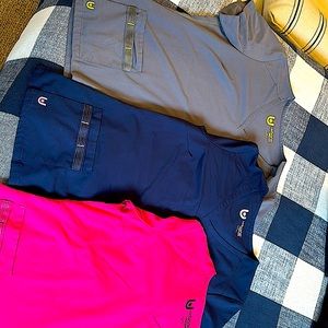 Bundle of three scrub tops.